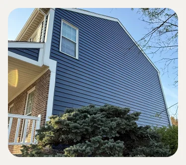 Side view of a home with blue siding